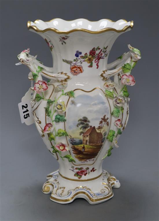 A late 19th century English bone china double handled vase, encrusted with flowers and having frilled rim heightened in gilt, topograph